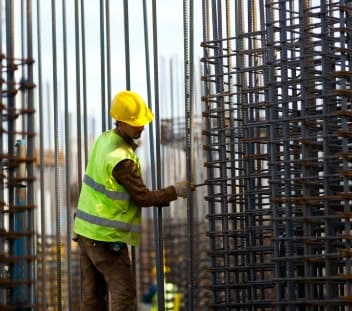 man-checking-iron-rods